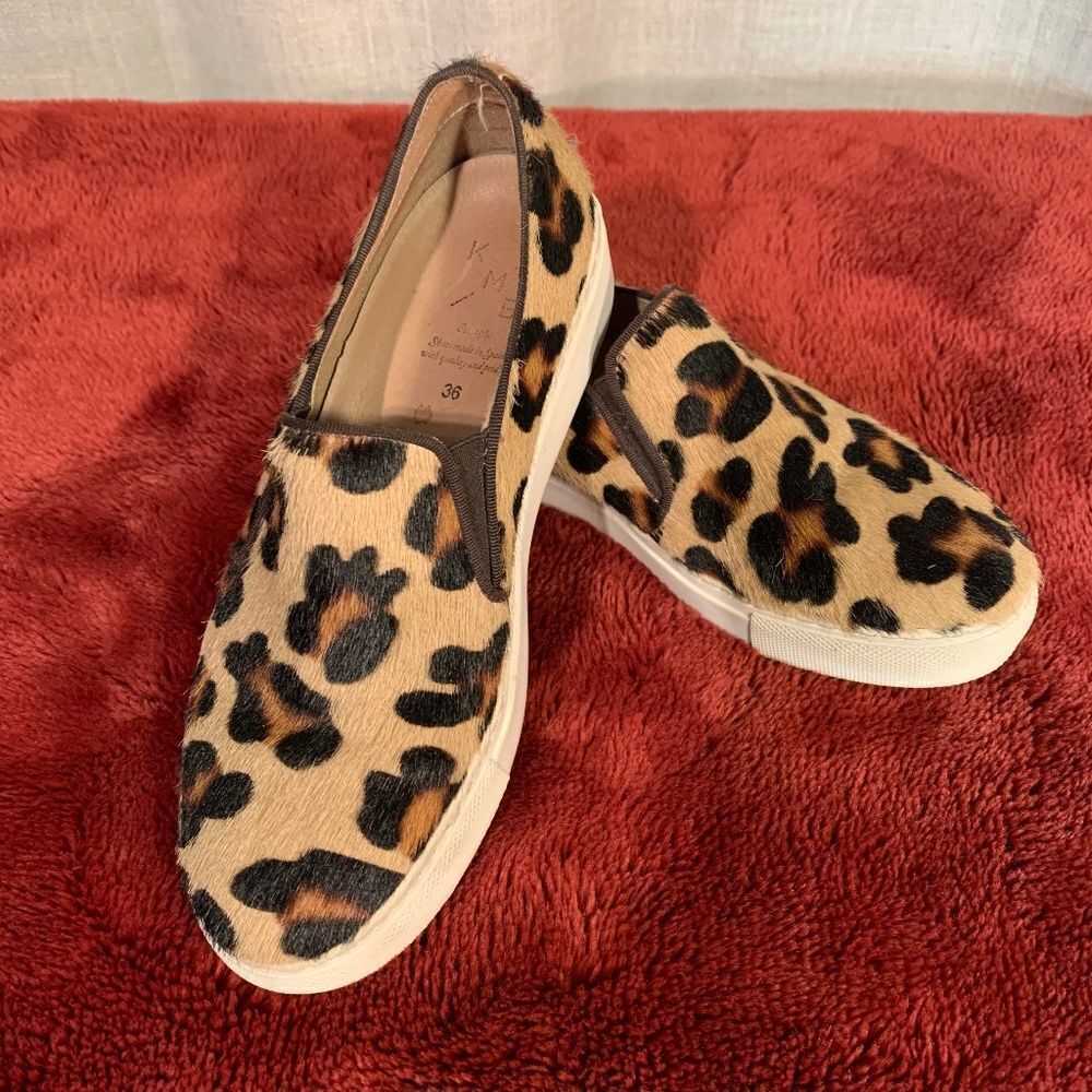 Leopard pony hair slip ons.